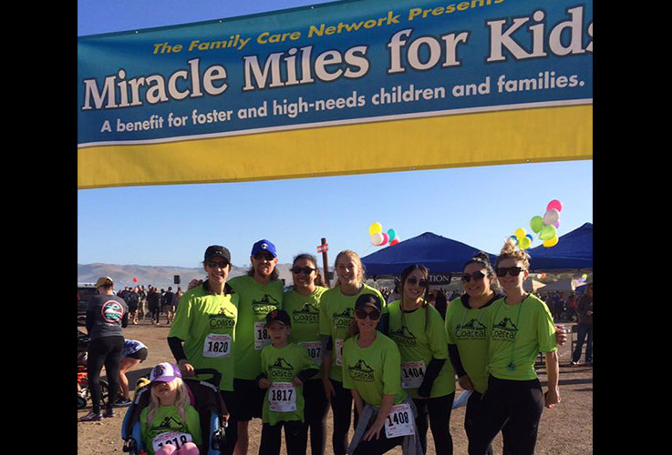 Team members at Miracle Miles for Kids event