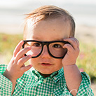 Smiling little boy with glasses