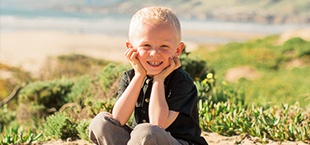 Smiling young boy on the beach