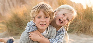 Two kids playing at beach