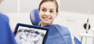 Smiling child in dental chair