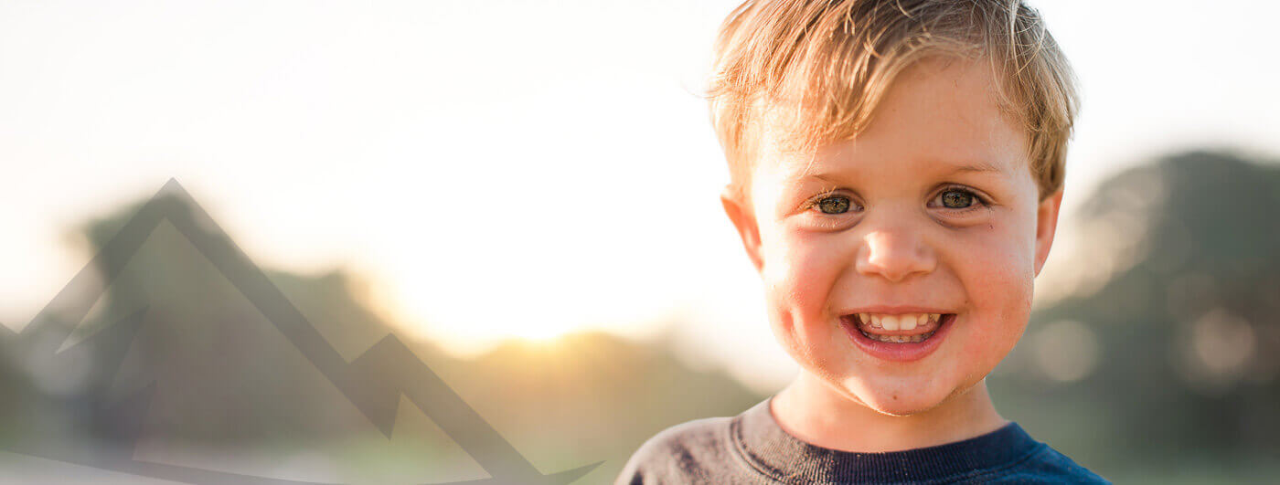 Smiling little boy outdoors