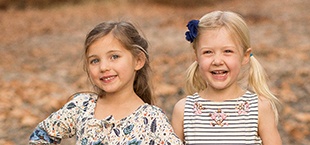 Two laughing girls at the beach