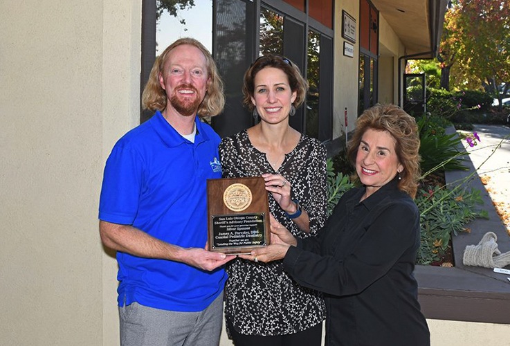 Dr. Forester receiving a plaque