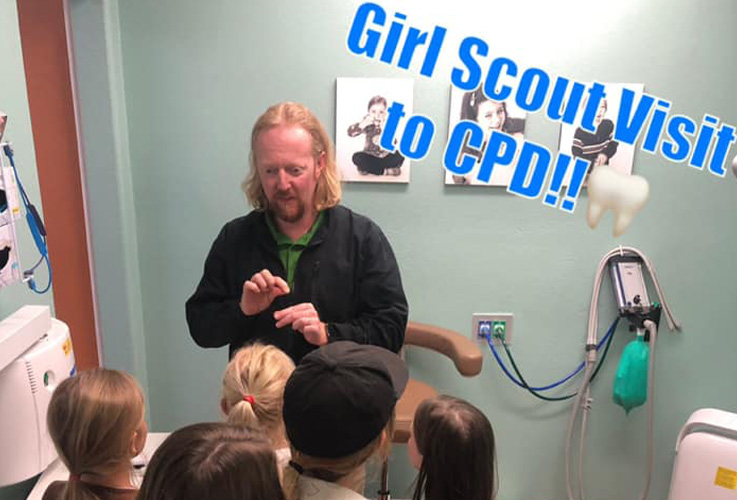 Dr. Forester talking to girl scouts