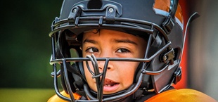 Boy playing football in San Luis Obispo