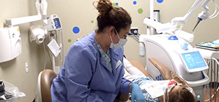 Child receiving dental treatment