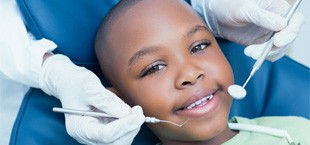 young boy smiling while visiting dentist in San Luis Obispo