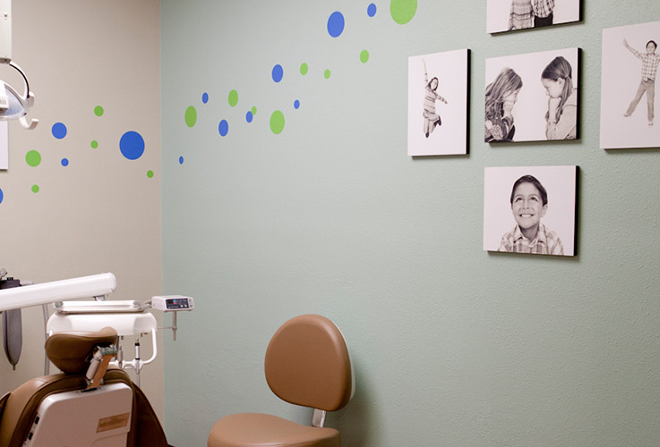 Kids pictures on dental treatment room wall