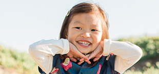 Smiling young girl outdoors