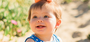 Smiling baby at the beach