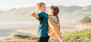 Two kids playing at the beach