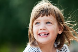 little girl smiling