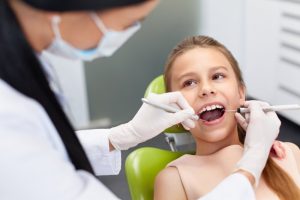 Young girl having a dental checkup. 