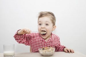 boy eating granola