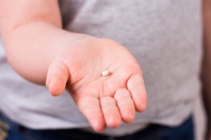 hand holding baby tooth