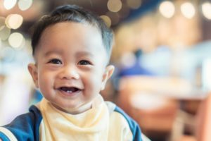 baby smiling with baby teeth