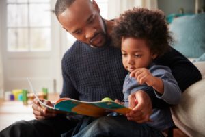 father reading to his child